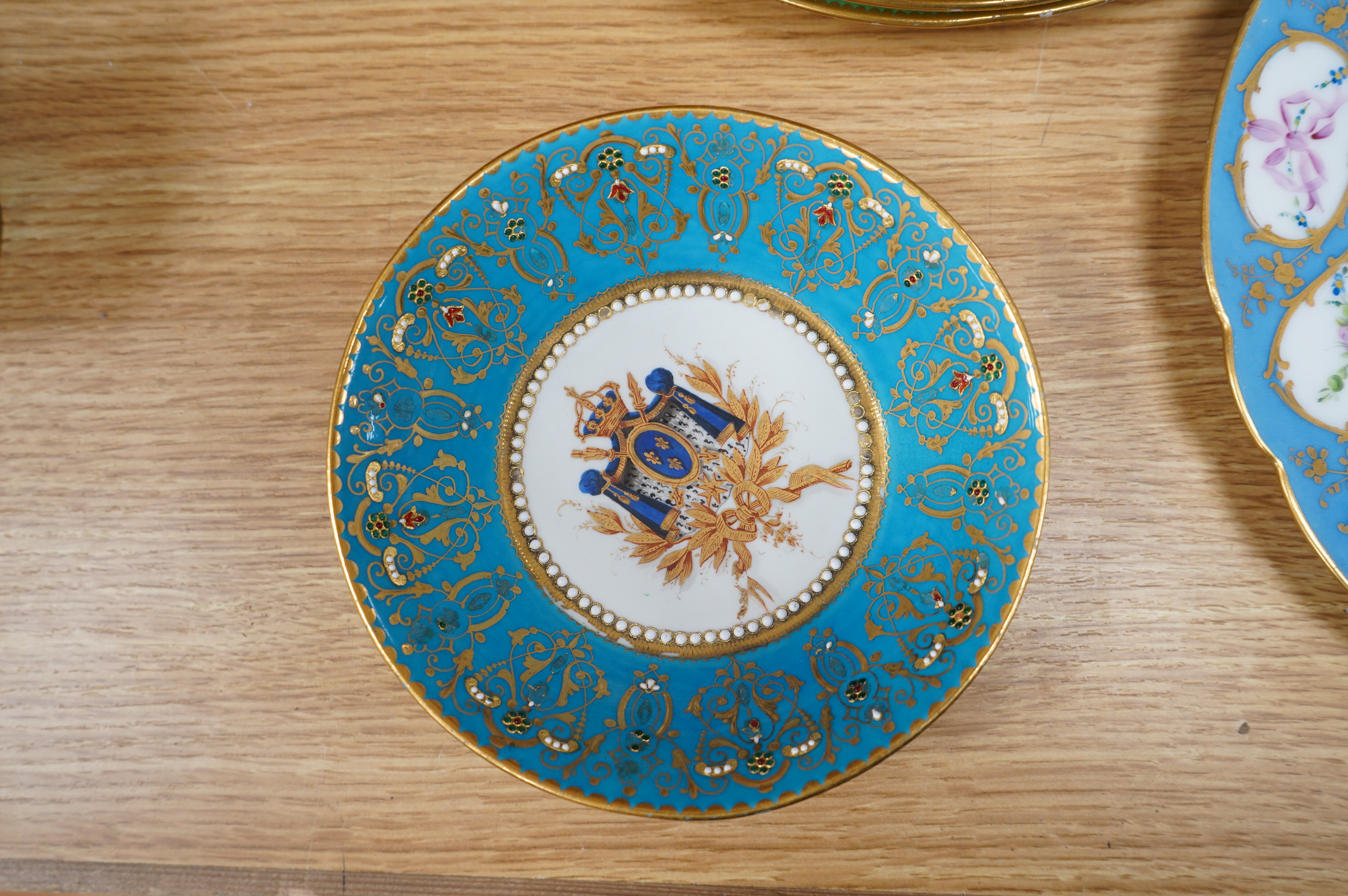 Three Sevres style plates, a Sevres coffee can and saucer and a similar plate, coffee can 7cm high. Condition - good